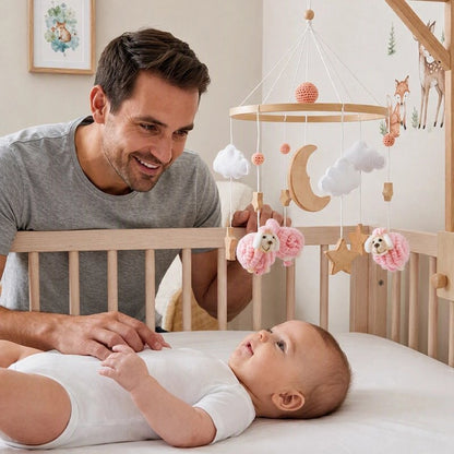 Mobile bébé avec nourrisson souriant regardant son papa